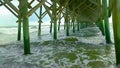 Hurricane induced waves slam pilings beneath pier