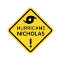 Hurricane Nicholas warning sign. Yellow rhombus icon with black border with hurricane symbol and caption