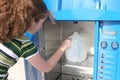 Hurricane Preparedness - Girl Fills Bottle Royalty Free Stock Photo