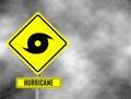 Hurricane sign road. Yellow hazard warning sign against grey sky - tornado warning, bad weather warning, vector illustration. Hurr Royalty Free Stock Photo