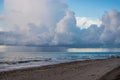 Hurricane storm with thick big dark clouds approaching beach in Florida over the ocean. Royalty Free Stock Photo