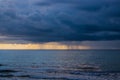 Hurricane storm with thick big dark clouds approaching beach in Florida over the ocean. Royalty Free Stock Photo