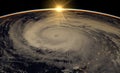 Hurricane visible above the earth, satellite view. Elements of this image furnished by NASA