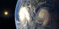 Hurricane visible above the earth, satellite view. Elements of this image furnished by NASA