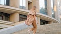 Hurried urban lifestyle stylish woman run up stair