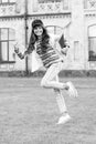 She is in a hurry to lesson. Energetic child holding lesson books. Little cute girl running to private lesson. Today is Royalty Free Stock Photo