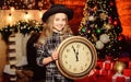 Hurry up to make wish. Girl santa claus hat and clock. Meet Christmas holiday. Festive atmosphere christmas day. New