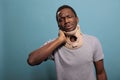 Hurt adult using neck collar to heal fractured vertebrae on camera