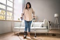 Hurt Leg Using Crutches Near Couch