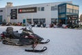 Longyearbyen, Svalbard in Norway - March 2019: Hurtigruten Svalbard Expedition Center in Longyearbyen. Snowmobile for Royalty Free Stock Photo