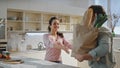 Husband bringing products bags to wife standing kitchen close up. Happy couple Royalty Free Stock Photo