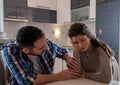 Husband comforting unhappy worried wife at home Royalty Free Stock Photo