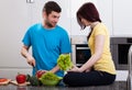 Husband cutting vegetables