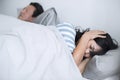Husband disrupting wife`s sleep with his loud snoring Royalty Free Stock Photo