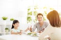 Husband gives his wife thumbs up for the delicious dinner