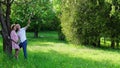 Husband with his pregnant wife in the park