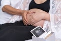 Husband and his pregnant wife showing heart with hands Royalty Free Stock Photo