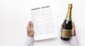 Husband planning to drink champagne celebrating after signing up divorce decree