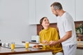 husband serving delicious breakfast near excited