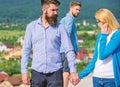 Husband strictly watching his wife looking at another guy while walk. Jealous concept. Man with beard jealous aggressive Royalty Free Stock Photo