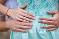 Husband touching his wife belly with hands Royalty Free Stock Photo