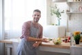 Husband welcoming his wife in the kitchen after cooking salad