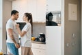 Husband and wife emotionally sort things out in the kitchen Royalty Free Stock Photo