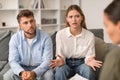 Husband and wife engage in marital counseling in therapist& x27;s office Royalty Free Stock Photo