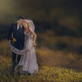 Husband and wife figurine with an inscription & x27;just married& x27; on a natural setting Royalty Free Stock Photo