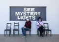 Husband and wife at a photography spot in Marfa, Texas referring to the famous Marfa mystery lights. Royalty Free Stock Photo