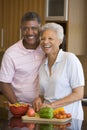 Husband And Wife Preparing Meal