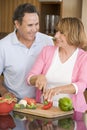 Husband And Wife Preparing Meal