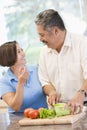 Husband And Wife Preparing meal, mealtime Together Royalty Free Stock Photo