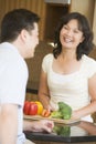 Husband And Wife Preparing Meal Together Royalty Free Stock Photo