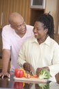 Husband And Wife Preparing A Meal Together Royalty Free Stock Photo