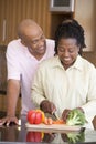 Husband And Wife Preparing A Meal Together Royalty Free Stock Photo