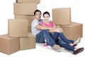 Husband and wife sitting with box Royalty Free Stock Photo