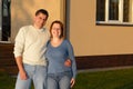 Husband and wife standing near house Royalty Free Stock Photo