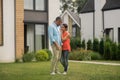 Husband and wife standing near their private house Royalty Free Stock Photo
