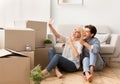 Husband And Wife Taking Selfie Gesturing Thumbs-Up Moving Apartment