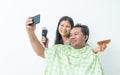 The husband and wife are taking the selfie ,White background