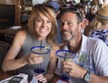 Husband and wife toasting Margaritas