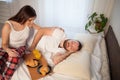 Husband and wife woke up in the morning, breakfast in bed Royalty Free Stock Photo