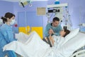 husband and woman giving birth in labor room hospital Royalty Free Stock Photo