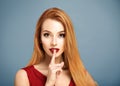 Hush. Woman with Finger on her Lips. Royalty Free Stock Photo