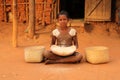 Young girl husking rice