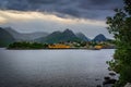 Husoy fishing village on the Senja Island in Norway with in heavy clouds
