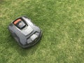 Husqvarna auto mower at work Royalty Free Stock Photo