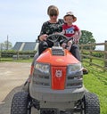 A Child and a woman on an Husqvarna TC 138 Ride-On Lawn Mower in UK on 2nd Aug 2020