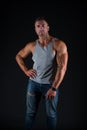 Hustle to gain more muscle. Fit guy with muscular arms black background. Sportsman show biceps triceps in casual wear